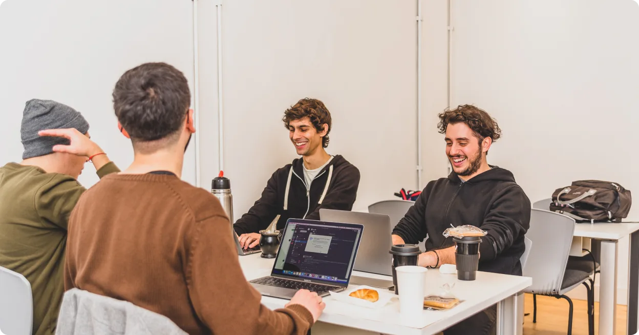 Rootstrap engineers working together at the office